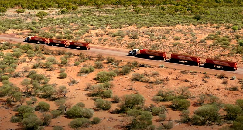 Overhead view of autonomous road trains driving in a remote location